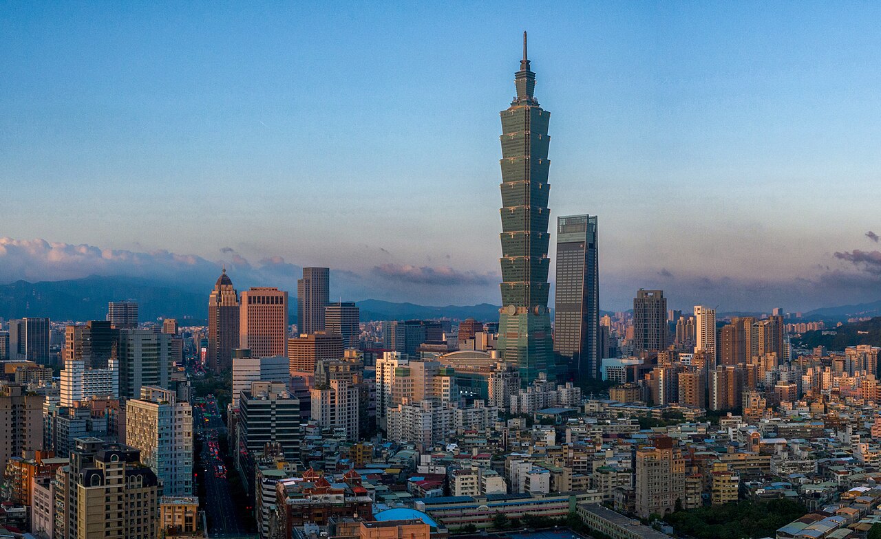 The Taipei skyline at dusk — the local financial centre from which this journal reads global climate risk.